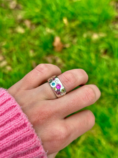 Mixed gemstone ring with two diamonds